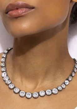 Catherine Round Rivière in White