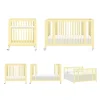 Rolli 9-in-1 Convertible All-Stages® Crib with Bassinet & Toddler Bed Conversion Kits in Pale Yellow